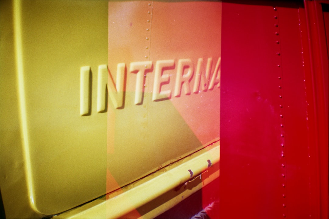 a close up of a red and yellow truck